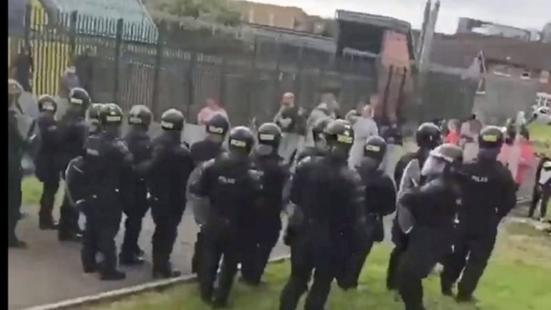 Riot police move into the Divis area of west Belfast. 