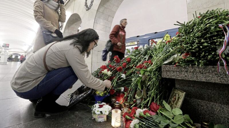 People lay flowers at Technologicheskiy Institute subway station in St Petersburg on Wednesday, April PICTURE: Dmitri Lovetsky/AP 