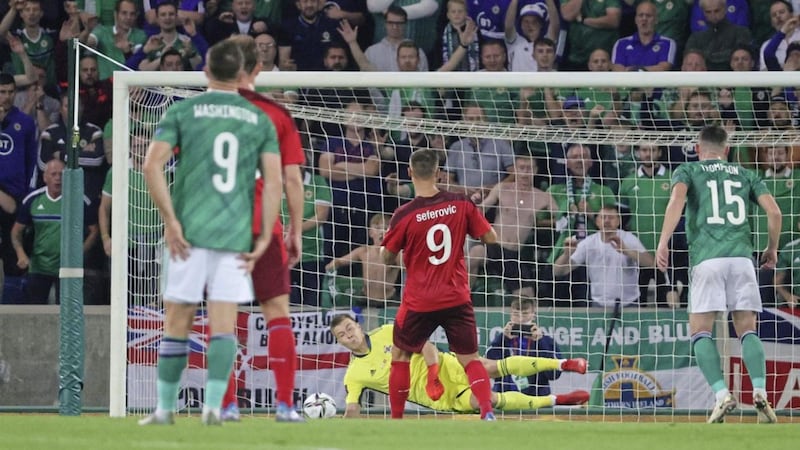 Northern Ireland&#39;s Bailey Peacock-Farrell saves a penalty from Switzerland&#39;s Haris Seferovic. 