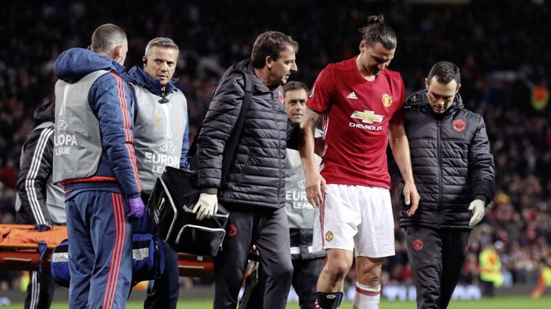 Manchester United striker Zlatan Ibrahimovic is helped off the Old Trafford pitch after injuring his knee in the victory over Anderlecht on Thursday night Picture: PA 
