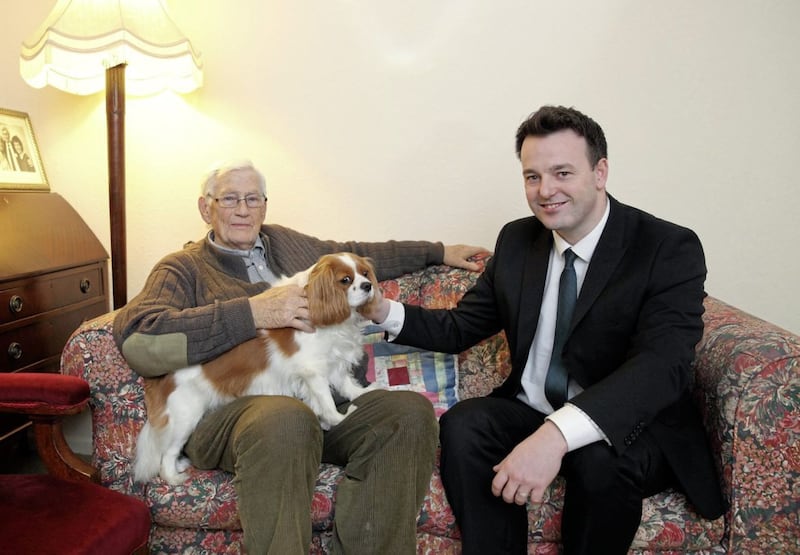 Mallon with current SDLP leader Colum Eastwood and his dog Jessie Picture: Cliff Donaldson 