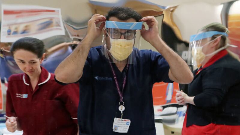 Medical staff don PPE at Craigavon Area Hospital in Co Armagh. Picture by Niall Carson/PA Wire&nbsp;