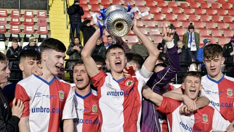 Linfield&#39;s Trai Hume lifts the Steel Cup after edging out Newington in the decider on Christmas morning 