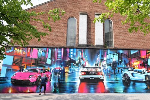 Fast cars mural on a church - it’s a message of prosperous hope, says organiser