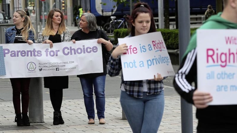 Pro-choice and anti-abortion campaigners outside the Royal Courts of Justice, Belfast where the Court of Appeal allowed an appeal against a lower court's ruling that abortion legislation was incompatible with the UK's Human Rights Act. Picture by Brian Lawless/PA Wire