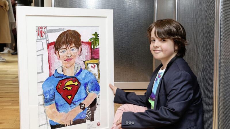 Alfie Whyte (8), a pupil at Cloughogue Primary School, Newry, with his winning artwork entitled My Brother Charlie 