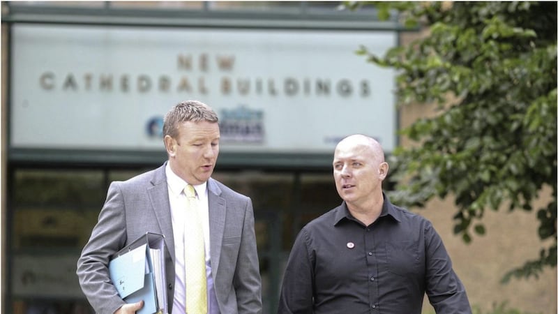 Ciaran Cunningham (right) is pictured with his solicitor Michael Brentnall outside the Police Ombudsman&#39;s Office in Belfast. Picture by Hugh Russell. 