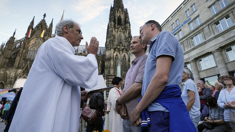 Same-sex couples take part in a public blessing ceremony in front of Cologne Cathedral in Cologne, Germany (Martin Meissner/AP/PA)