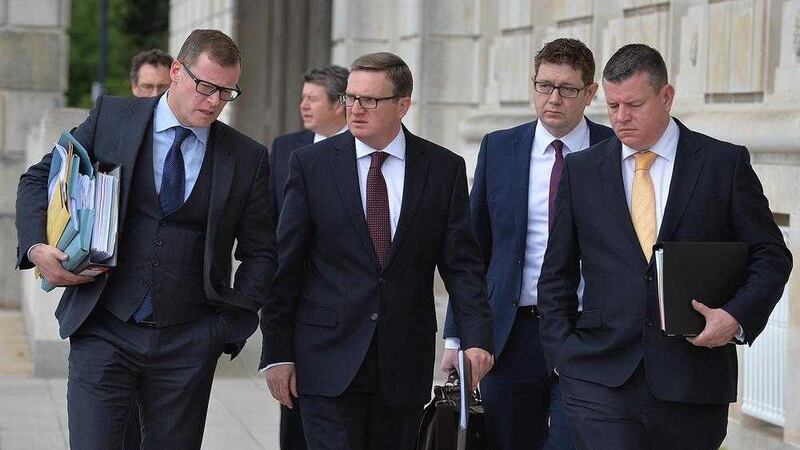 Gareth Graham (second left) leaving Stormont recently with his lawyer Kevin Winters (left) after speaking to the Nama inquiry