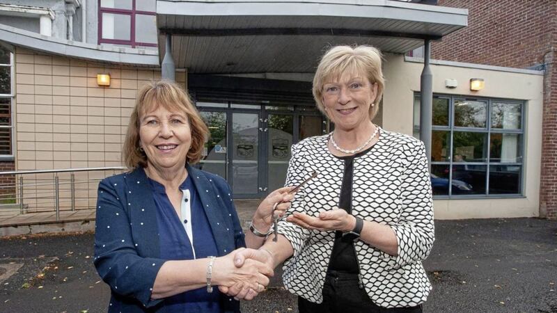 Professor Terri Scott, left, principal and chief executive of Northern Regional College, accepts the keys of St Joseph&rsquo;s College, Coleraine, from Mrs Mary Millar who retired as principal on August 31      