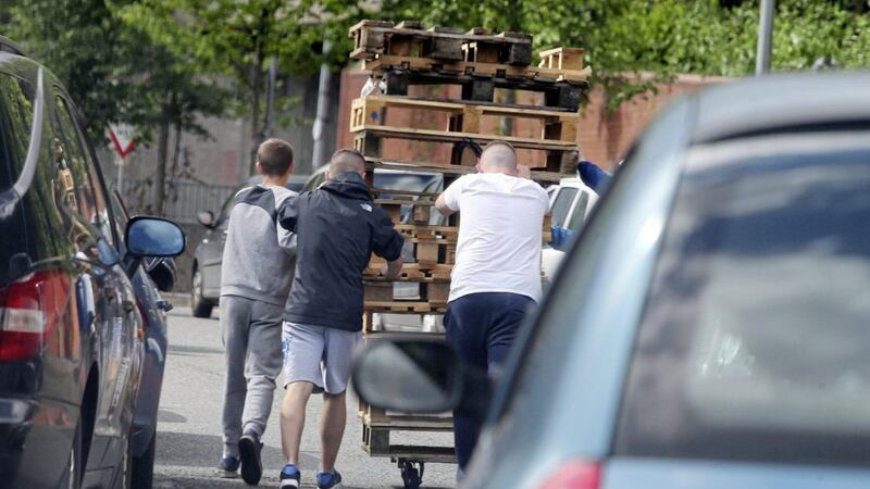 ON THE MOVE: Youths wheeling wooden pallets from Belfast city centre to the nationalist New Lodge area 