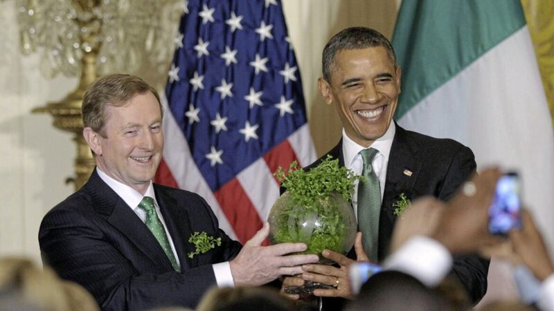 President Barack Obama and Taoiseach Enda Kenny hold up a bowl of shamrocks during a St Patrick&#39;s Day reception in the White House in 201. Picture by AP/Susan Walsh 