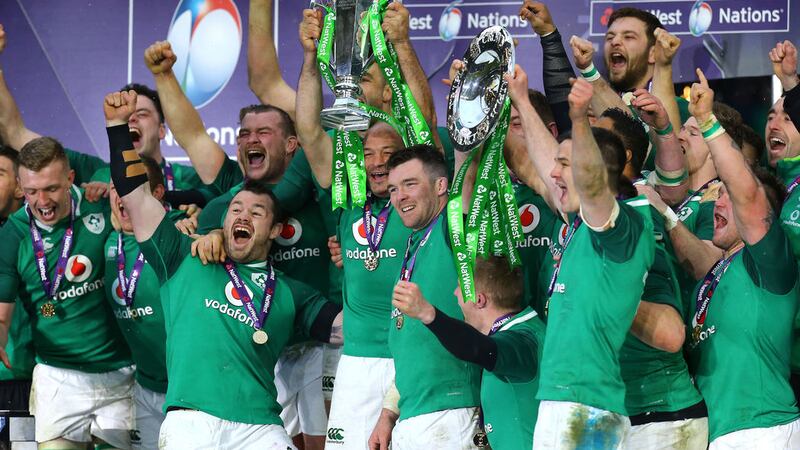 Ireland's Peter O'Mahony (centre) and team-mates celebrate with the Grand Slam trophy after beating England 24-15 in the NatWest 6 Nations match at Twickenham Stadium, London. &nbsp;