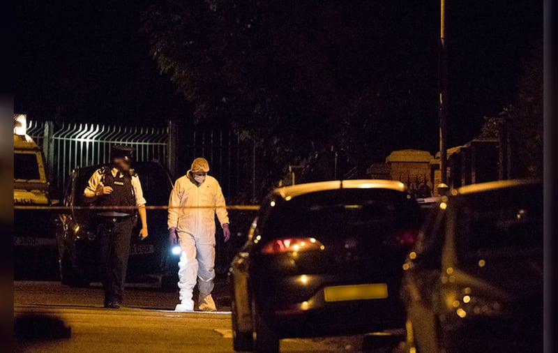 Police at the scene of an attack on Gerry Adams' home in west Belfast last week