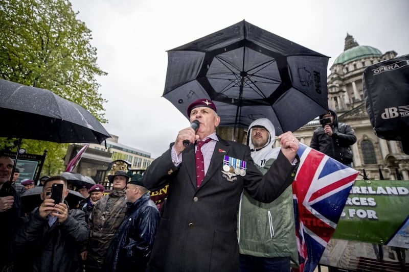 John Ross, a Parachute Regiment veteran, addresses protesters outside Belfast city hall during a rally for soldier F, a former paratrooper who is due to stand trial for murder and attempted murder for his role in the 1972 Bloody Sunday killings. Picture by Liam McBurney, Press Association