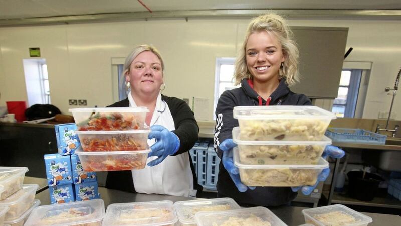 Stacey McCluskey and Robyn McKee prepare meals donated to pupils at Seaview PS in north Belfast. Picture by Mal McCann 