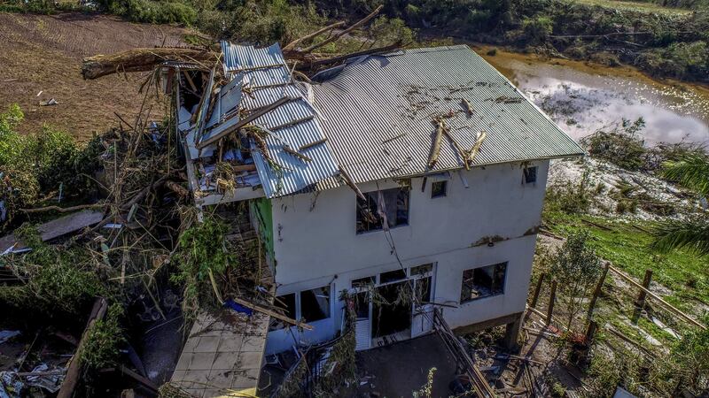 A destroyed home in Mucum (Wesley Santos/AP)