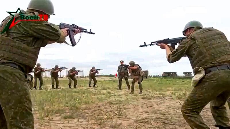 Belarusian soldiers attend a training by mercenary fighters from Wagner private military company near Tsel village, about 55 miles south-east of Minsk (Belarusian Defence Ministry via VoenTV via AP)