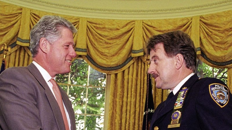 Bill Clinton with decorated NYPD officer and founder of Project Children Denis Mulcahy. 
