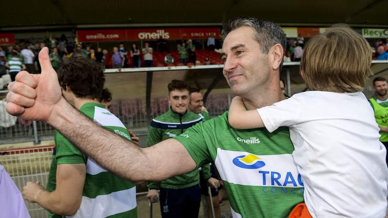 Rory Gallagher celebrates with his young son Seanie at the final whistle of yesterday's victory for Fermanagh over Monaghan Picture by Oliver McVeigh/ Sportsfile