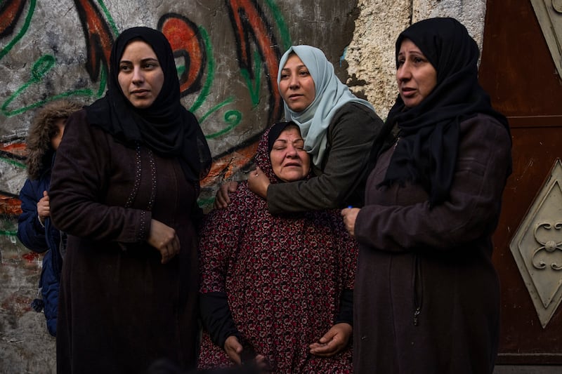 Palestinian women react after their home was hit by an Israeli strike in Rafah, southern Gaza Strip (Fatima Shbair/AP)