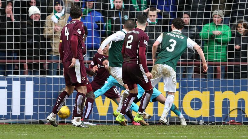 <span style=" line-height: 20.8px;">Hibernian's Paul Hanlon pokes home the injury-time equaliser against Hearts during the Scottish Cup fifth round clash at Tynecastle on Sunday<br />Picture by PA</span>