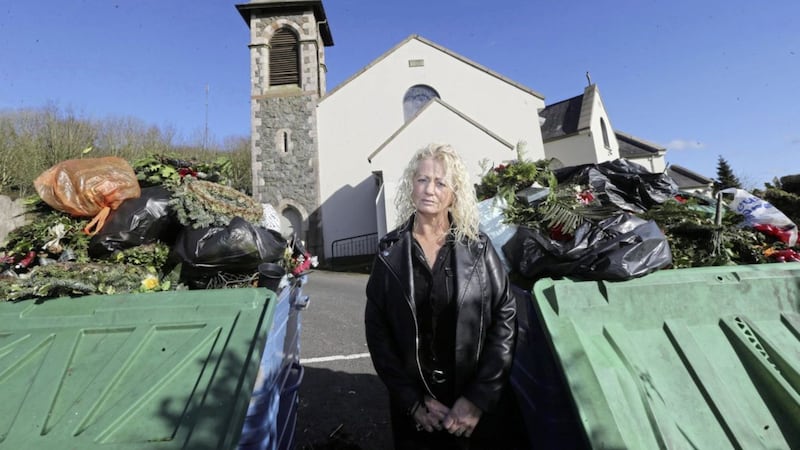 Michelle Connors has expressed her anger after personal belongings were removed from graves at Hannahstown Cemetery in Belfast at the weekend. Picture by Hugh Russell. 