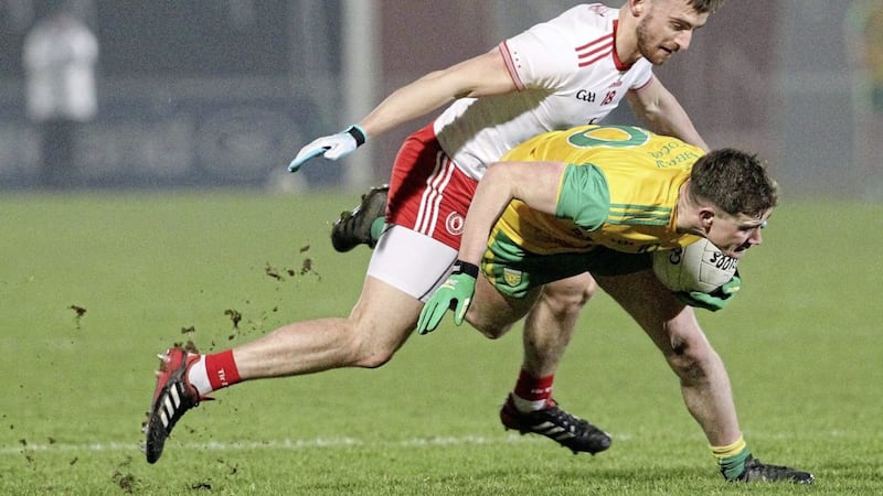Donegal&#39;s Ciaran Thompson and Padraig Hampsey of Tyrone Picture by Philip Walsh 