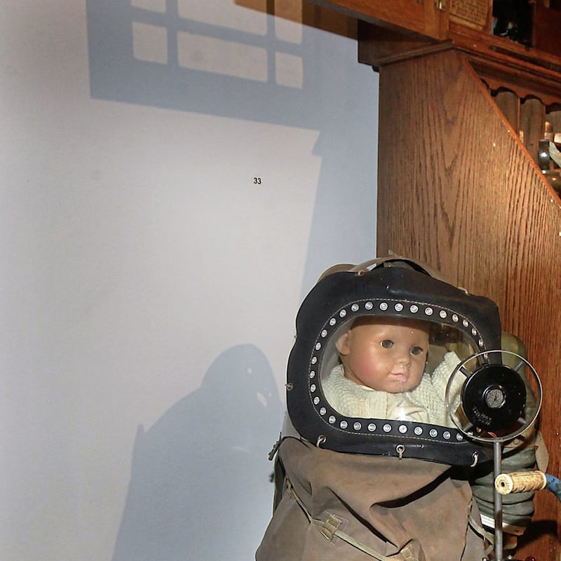 A childs gas mask features among items in the Curious Collections exhibition at the Tower Museum in Derry. Picture Margaret McLaughlin 