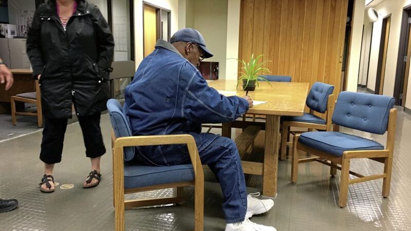 OJ Simpson signs documents at the Lovelock Correctional Centre on Saturday. He was released early on Sunday