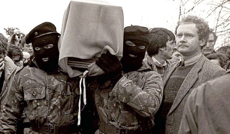 Martin McGuinness pictured with masked IRA men at the funeral of Brendan Burns in 1988. Picture by Pacemaker 