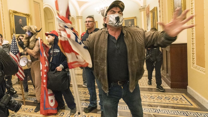 Supporters of President Donald Trump walk the hall outside the Senate Chamber inside the Capitol in Washington. Picture by AP/Manuel Balce Ceneta&nbsp;