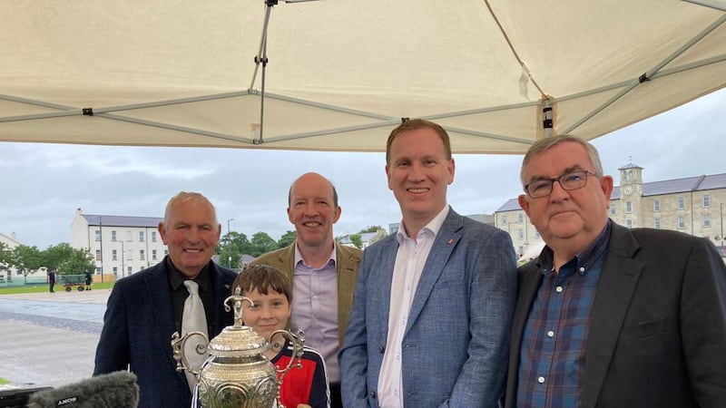 The Antiques' Roadshow silver expert (pictured centre) examined the cup which was brought to Ebrington Square by, from left, Sean Corry of St Patrick's, The Loup, his grandson, Bradley Dolphin, GAA writer and historian, Dónal McAnallen and former Derry GAA chairman, Sean Bradley. 