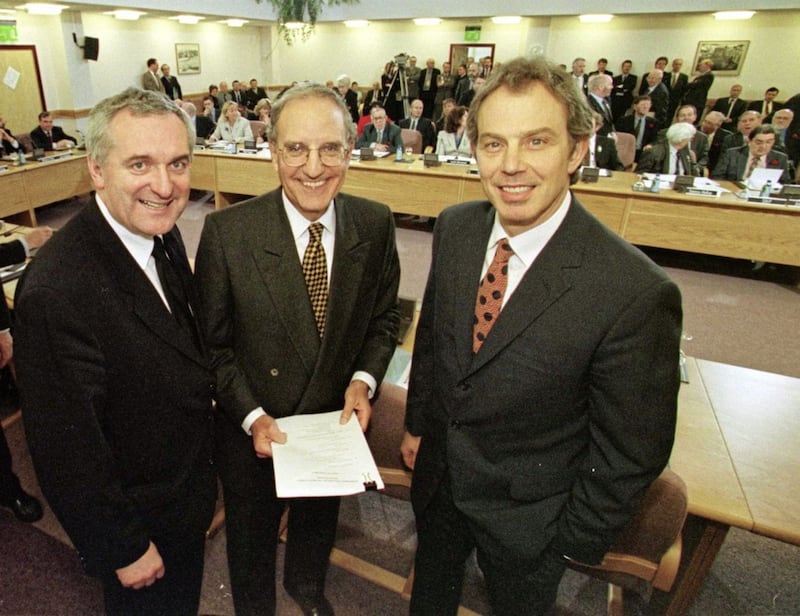 File photo from 10/04/98 of former British Prime Minister Tony Blair (right) former US Senator George Mitchell (centre) and former Taoiseach Bertie Ahern (left) smiling after they signed the historic agreement for peace in Northern Ireland.&nbsp;