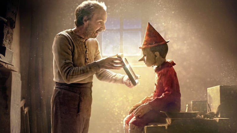 Roberto Benigni as Gepetto and Federico Ielapi as Pinocchio 