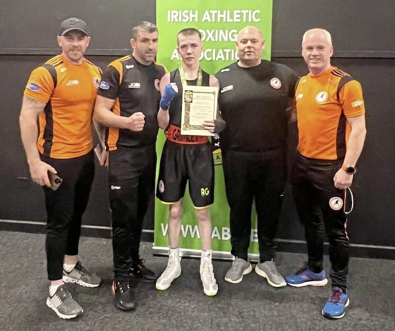 Armagh Boxing Club's Ryan Grimley with, from left, coaches Patrick Traynor, Donald Renaghan, Eoin Smith and Paul O'Callaghan. The other Armagh coaches are Charlene Dougan, Chloe Clarke, Richard Clarke and Christopher Renaghan 