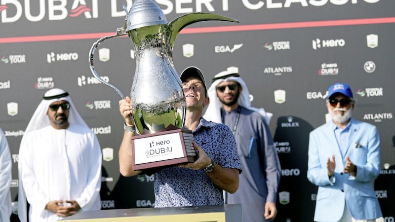 Rory McIlroy of Northern Ireland holds his trophy after he won the the Dubai Desert Classic in  the UAE last month. 