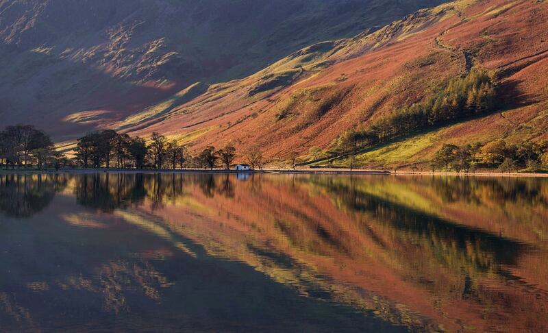 Autumnal reflections in lake Buttermere in the Lake District, Cumbria 
