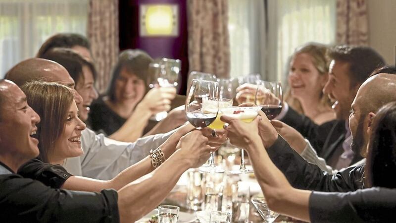 SOMETHING TO CHEER: Diners raise their glasses at a restaurant as Covid restrictions finally start to ease 