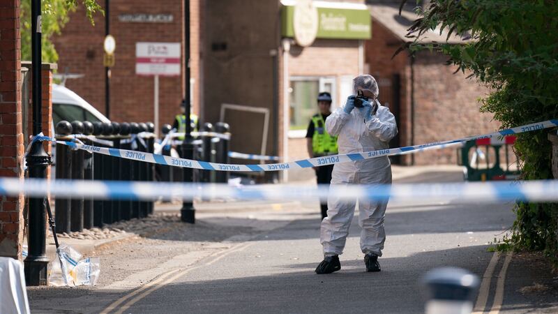 A forensic officer near the scene in Boston after a nine-year-old girl died from a suspected stab wound. Picture by Joe Giddens/PA Wire