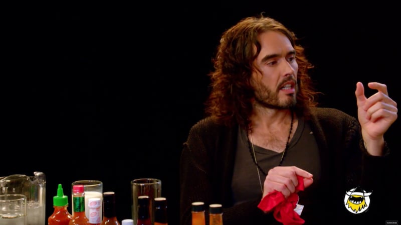 Russell Brand finally reaches enlightenment - while doing the Hot Ones spicy wings challenge