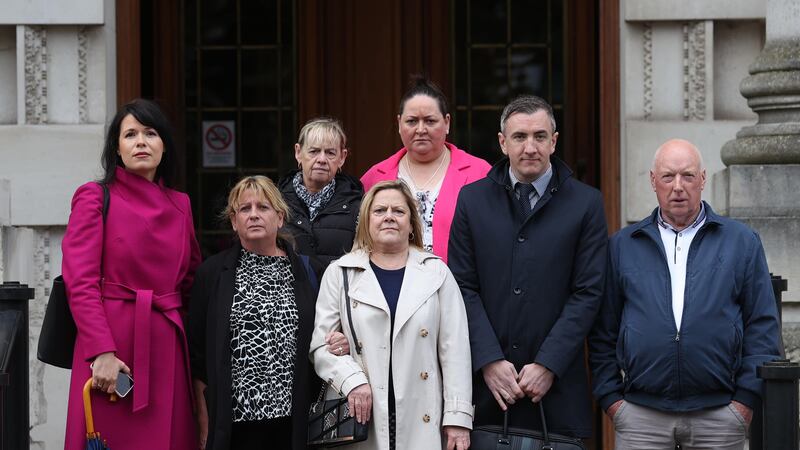 From left: Grainne Teggart, deputy director of Amnesty International in Northern Ireland; Martina Dillon, wife of Seamus Dillon; Donna, Lynda, and Isobel McManus, daughters of James McManus; and Gavin Booth of Phoenix Law with Peter McCarthy outside the Royal Courts of Justice in Belfast (Liam McBurney/PA)
