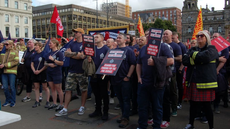 Firefighters staged a rally against cuts to fire service funding proposed by the Scottish Government (PA)