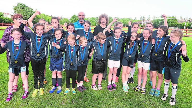 CELEBRATION: Rosario YFC girls&rsquo; football team after receiving their awards at the Ulidia playing fields 