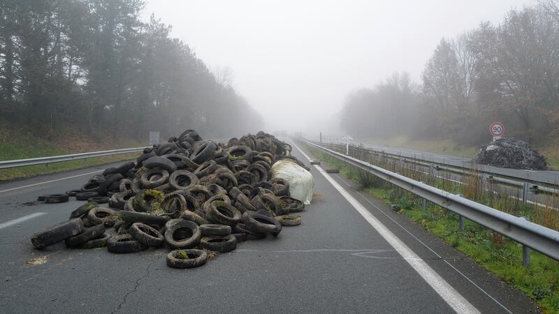 Tyres lie on the highway during a blockade, near Agen, south-western France (AP Photo/Fred Scheiber)