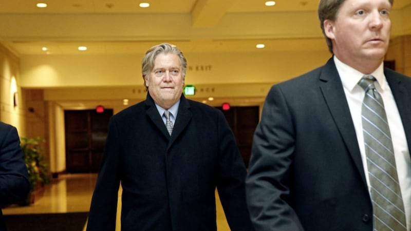 Former White House strategist Steve Bannon, left, leaves a House Intelligence Committee meeting where he was interviewed behind closed doors on Capitol Hill PICTURE: Jacquelyn Martin 