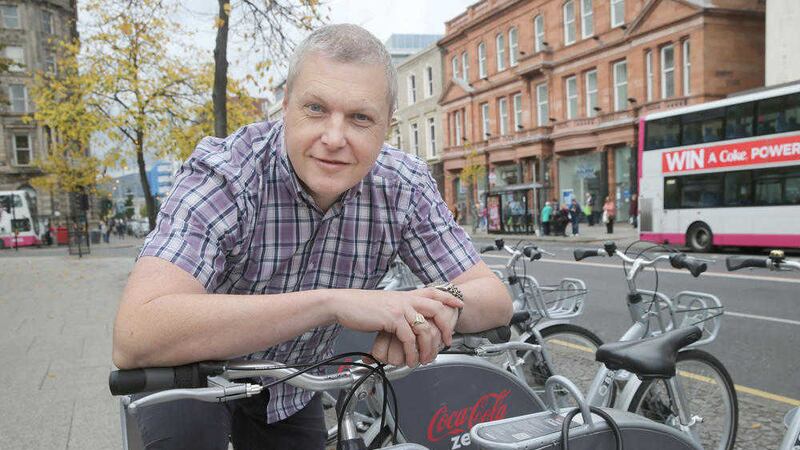 Colin Thompson took the 100,000th trip on a Belfast bike. Picture by Hugh Russell&nbsp;