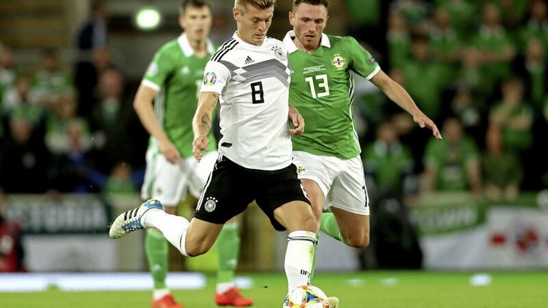 Northern Ireland's Corry Evans (right) closing down Germany's Toni Kroos during a Euro 2020 qualifier at Windsor Park.