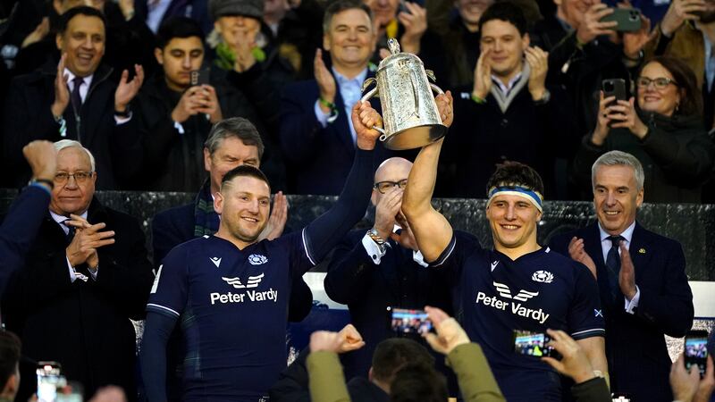 Scotland’s Finn Russell (left) and Rory Darge lift the Calcutta Cup aloft after victory over England
