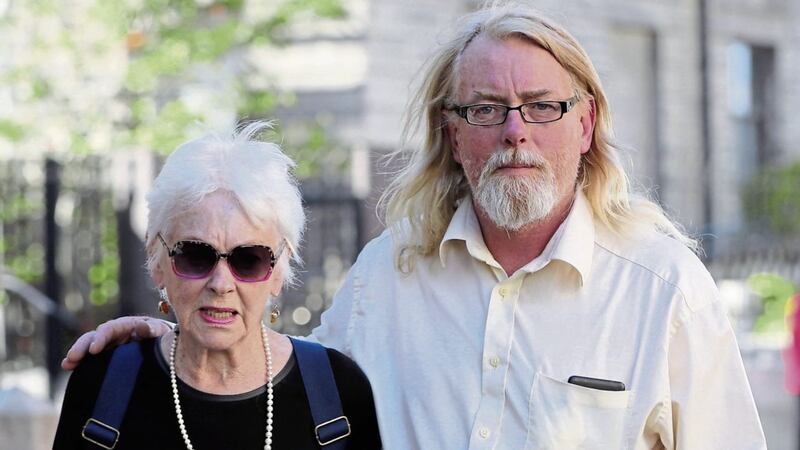 Tressa Donnelly Reeves (79), and her son Andre Donnelly leave the High Court in Dublin where they began a legal action against a Catholic adoption agency and the State, alleging he was illegally adopted 57 years ago PICTURE: Niall Carson/PA 